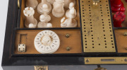 An impressive antique games box, coromandel and satinwood with brass fittings. Interior fitted with compartments, lift out tray and double-sided games board. Includes a fine array of carved bone and ivory gaming pieces comprising chess, draughts and backg - 6