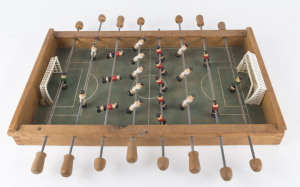 Vintage table soccer game; together with a vintage folkart pinball game, mid 20th century, the pinball 76cm high