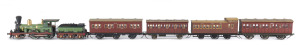 c.early 1880s B Class (B50) Steam Locomotive (190x35x50mm) built by Beyer, Peacock & Co in England, green livery with gold plated trim, 2-4-0 wheel configuration, with rolling stock comprising three passenger carriages and a 'YZ' Guard Van, total size 640x35x50mm. (6 items)