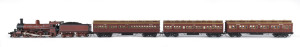 c.1905 Dd Class (Dd668) Steam Locomotive (235x40x55mm) rebuilt with new larger boiler based on the K Class design (Nos 606-699), probably constructed at Newport Railway Workshops, red-brown livery with deep brown trim, 4-6-0 wheel configuration, designed for both passenger and freight duties with rolling stock comprising three passenger carriages, total size 1120x40x55mm. (5 items)
