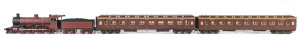 c.1907 Aa Class (Aa574) Steam Locomotive (255x40x57mm) being the A2 version introduced in 1907 to be used on express/premier services hauling the heavier E type passenger carriages which came into service in 1906, red-brown livery with deep brown trim, 4-6-0 wheel configuration, with rolling stock comprising two E type passenger carriages, total size 840x40x60mm. (4 items)