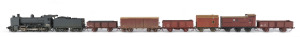 c.1947 K Class (N184) branch line Steam Locomotive (240x40x55mm) built post WWII at the Newport Workshops, black livery, 2-8-0 wheel configuration, with rolling stock comprising five goods carriages and a Z guard carriage at the back, total size 840x40x55mm.(8 items)