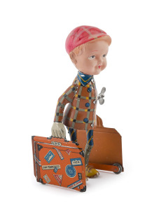Clockwork wind-up tin-plate bell-hop boy with two suitcases; celluloid head; "C.K." brand, Japan; circa 1940s. Height: 20cm (8").