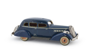 Japanese tinplate clockwork Graham Paige 4-door saloon, marked "T.N." in diamond; circa 1930s. Length: 22cm (8.5").