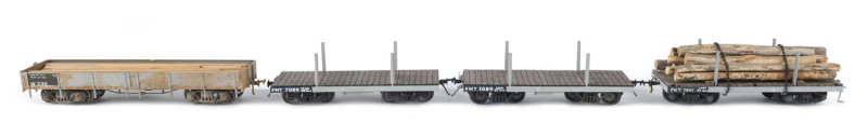 Group of four early 20th century narrow gauge goods wagons, two loaded with timber or with logs. (4 items)