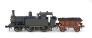 1893 P Class Tank Engine, road number '21' (120x35x50mm) built by James Martin & Co (Adelaide), black livery, 2-4-0 wheel configuration, with rolling stock comprising an extended coal bunker plus four wagons one loaded with timber. (6 items) - 2