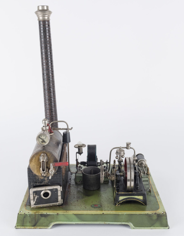 1930s Doll & Co steam engine with double action cylinder, ethanol heater, stop valve, glass gauge, manometer, steam whistle, etc; all affixed to a green painted cast metal stand with 'DC/MADE IN GERMANY' maker's mark on the front face, base 28x23cm, heigh