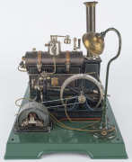 Early 1930s Marklin composite steam plant with boiler, engine, large flywheel, electric dynamo powering a lamp, Marklin “GM & Cie” maker's plates on the boiler and on the dynamo, mounted on 33x26cm cast iron base, height 30cm, weight 2.4kg. - 2