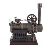 c.1910 Falk Overtype stationary Steam Engine Type JF450, with feed water pump, 7cm diameter burnished brass boiler, 7½cm flywheel, mounted on cast iron base painted red; 19½x12½cm base, height 28cm, weight 2kg.