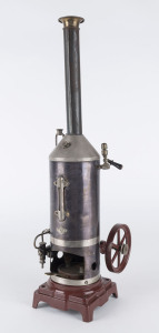 1920s Bing steam engine with burnished brass vertical boiler and inverted steam engine, water gauge, flywheel, steam whistle & safety valve, tall chimney; maker's name plate on outer boiler wall, mounted on cast-iron base painted brown, base 10½x10½cm height 44½cm, weight 1.40kg.