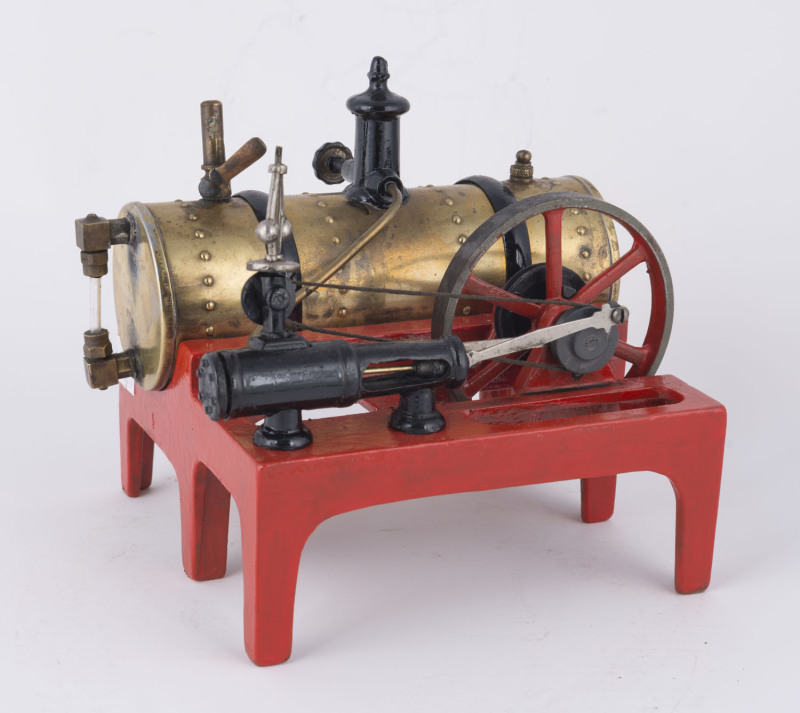 c.1925 Weeden Model No. 14 horizontal steam engine, riveted brass boiler, cast iron base painted bright red, measures 14½x14½cm at base, height 16cm, weight 1.70kg.