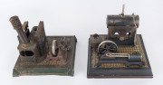 c.1910 Ernst Plank horizontal stationary steam engines (2), both missing parts (one with chimney that may not belong), both mounted on pressed metal bases with Plank name plates on the boiler house wall . Possible restoration project(s). (2)