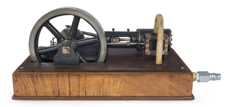 c.1920s high quality scratch built model of single cylinder horizontal mill engine, featuring 13cm diameter flywheel, mounted on metal plate, screwed to a wooden plinth (33x17cm) with a 20pf pneumatic power connector, height 15cm, 3.85kg.
