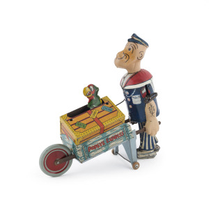 American lithographed tinplate Popeye Express - Baggage Cart with pop-up “Salty” the Parrot; 1930s. Height: 21cm (8.5").