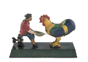 Boy feeding a giant chicken, wind-up tinplate toy by Toyodo & Co., Japan; 1920s. Length: 18.5cm (7.25").