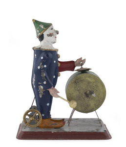 Tin-plate clown with bass drum and cymbal, mechanical hand-wind mechanism; probably German, late 19th Century. Height: 16cm (6.25").