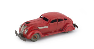 1930's Chrysler Airflow wind-up four-door sedan in bright red; probably by Kuramochi. Length: 28cm (11").