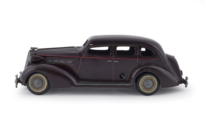 Tinplate Clockwork Maroon Saloon Car; 1930's Cadillac; probably by Kuramochi.  Length: 28cm (11").