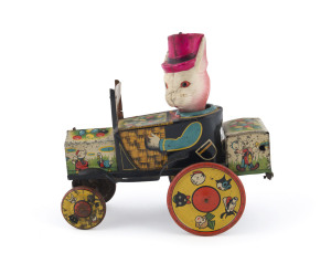 LITHOGRAPHED TIN MECHANICAL"UNCLE WIGGILY CRAZY CAR"The elaborately-lithographed car features numerous characters from the Uncle Wiggily stories, depicted in action scenes, along with colourful baskets of eggs the wheels with decorated animal heads, and U
