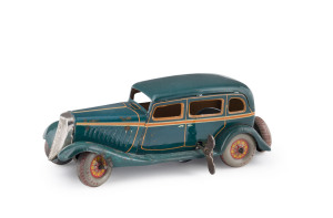 1933 wind-up Ford sedan in aqua, by Kuramochi; the spare tire with printed "1934 CHICAGO WORLD'S FAIR". Length: 19cm (7.5").