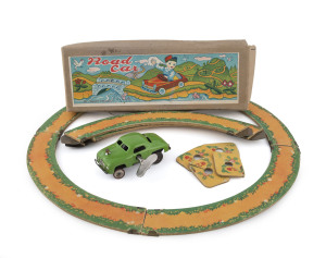 Road Car, by T. Sekiguti marked "MADE IN OCCUPIED JAPAN" under the chassis; in original box with interlocking road sections, instruction sheets in English and Janapese and the original winding key. circa 1950. Length (of car): 8cm (3.25"); Box: 23cm (9").