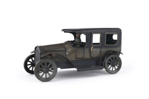 KARL BUB, Germany, circa 1912, open cabin limousine with uniformed driver; olive chassis with black roof and running boards, with wind-up mechanism intact; 2 doors can open. Length: 26cm (10.25").