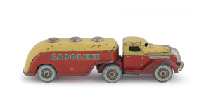 Tinplate traction/windup GASOLINE tanker truck, made by Masudaya, Japan, 1930s.Windup mechanism is in working order. Both sections trailer are marked: MT. Rare advertisement pre-war Japanese tanker/gas truck with tin wheels and chrome details. Length: 20cm (8").