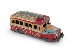 Red Wing tinplate lithgraphed bus; friction drive, with "Over the Hill" destination; made by Marusan, Japan, circa 1930s. Length: 13.5cm (5.25").
