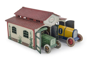 Delightful LEHMANN DRGM two car garage (#772) with clockwork Lehmann yellow & blue Race Car #1 GALOP (760) Pat 2 Dec.1913, U.S.A. 25 Jan. 1927 and Lehmann green Sedan (765) with identical patent details. All pieces marked "Made in Germany" and in exceptional condition (except for a small area of paint loss to one corner of the garage roof.); circa 1930. Garage dimensions: 11cm high, 18cm wide, 16cm deep. (3 items).