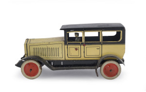 A tinplate windup town car or limousine by Johann Distler, Germany; with number plate "J.D. 1602", original driver, JDC logo on back above "MADE IN GERMANY"; circa 1920s. Length: 20cm (8").