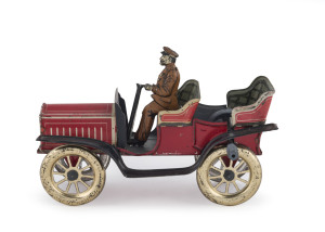 An early 20th Century open touring car, lithographed tinplate, with a uniformed driver using a tiller for steering; German, possibly by Meier or Issmayer. Length: 15cm (6").