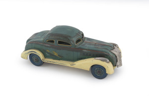 A clockwork tinplate 1938 Hudson 2-door coupe by Kosuge, Japan. Length: 16.5cm 6.5"). This example illustrated at p.118 "The Big Book of Tin Toy Cars" by Ron Smith & William C. Gallagher [Shiffer Publishing, PA., USA] 2004.