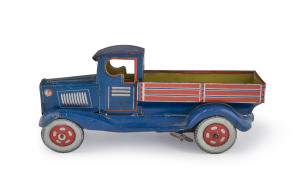 A wind-up pick-up truck by Modern Toys/Masudaya, circa 1930s. Length: 22cm (8.75").