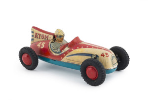 ATOM 45 friction powered racer; tin plate lithographed; by Marusan Toys (Japan). With original driver, rubber wheels and red hubcaps. Length: 22cm (8.75").