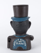 An American style cast iron money box with emblazoned title, 21cm high. - 2