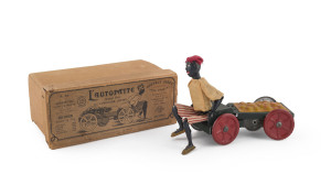 "L'AUTOPATTE" designed by Fernand Martin but made by by Georges Flersheim, one of his successors after 1912. With the original box. The orange vendor with hand-painted face; the wind-up mechanism drives the cart which, in turn, move the vendors feet. An award winning prize, as noted on the box lid. Box length: 19cm (7.5"). An example (without box) sold in January 2013 for US$6,600 after a battle resulting in 51 bids.