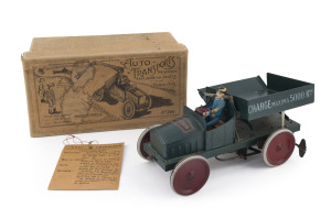AUTO-TRANSPORTS MECANIQUE by FERNAND MARTIN A clock-work tinplate dump truck in the original box, the lid with complete label numbering the toy "No.246". Made after 1919 by Francis Victor Bonnet, who had acquired the company in that year; with the BONNET 