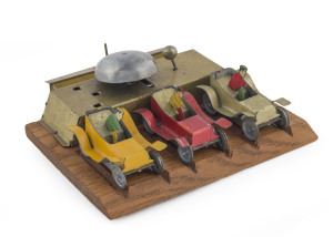 Set of three Penny Toy size Tinplate Race Cars with drivers on a Wooden Platform; No makers mark but they are most likely of Japanese origin, circa 1930s. The cars are propelled by pulling back on the rear lever and disengaging the brake. The platform is 