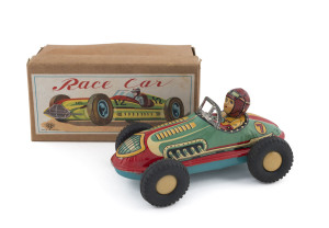 Japanese tinplate friction powered Race Car No.7 in original box with full colourful top label. Chassis, driver and rubber wheels all in original condition; circa 1950s. Length: 16cm (6.25").