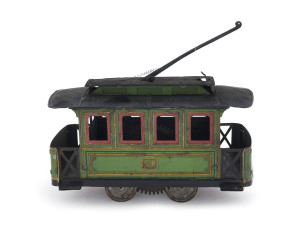 CHARLES ROSSIGNOL TROLLEY-CAR, France, early tin lithographed electric street trolley, green body, black roof, interior key wind, platforms on each end. Length: 21cm (8.25"). Provenance: The Fred Castan Collection, Bertoia Auctions, Sept. 2011, Lot 937.