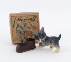 PLAYING DOG tin and celluloid wind-up toy (with key) in original box with printed lid, by S.N.K. and marked "MADE IN OCCUPIED JAPAN", circa 1948. Box size: 9.25 x 9.25cm (3.75 x 3.75").