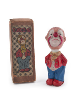 "COXCOMB" the Sad Clown, made by Kuramochi in original box with top label, marked "Made in Japan." Wind-up celluloid toy with original key, circa 1930s. Height:19.5cm (7.75").