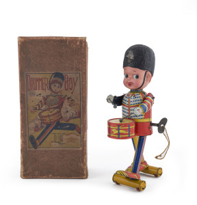 DRUMMER BOY wind-up tinplate toy with celluloid head by Fukuda, Japan; complete, working and in original box. Height: 24cm (9.5").