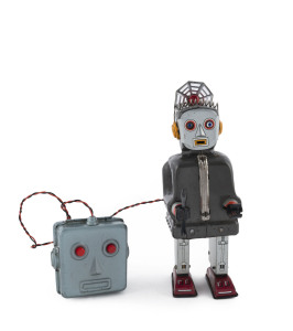 RADAR ROBOT by Nomura, Japan; with blinking light and eyes,spanner tool in right hand, battery operated remote control unit and all in original condition; circa 1950s. Height: 21.5cm (8.5").