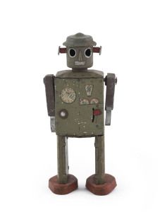 ATOMIC MAN tin-plate lithographed clockwork robot; "JAPAN" on lower edge of back panel; circa 1948 original version in olive green. Height: 12.5cm (5").