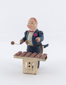 Celluloid and metal windup XYLOPHONE PLAYER by Modern Toys, Japan; circa 1950. Height: 15cm (6").