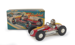 "FIREBIRD 55" race car with driver in original box; tinplate, lithographed with rubber wheels, friction powered; marked "JAPAN". Length: 16.5cm (6.5").