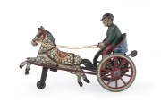 Tin plate lithographed trotting horse with driver, with windup mechanism below seat; marked "HAYAKAWA SEI"; non-original reins. Appears to be circa 1930s. Length: 19cm (7.5").