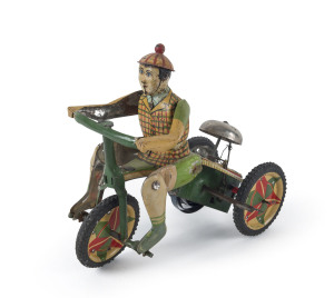 Vintage tinplate lithographed windup tricycle rider with bell; marked "MADE IN JAPAN" on wheels and rear of mechanical housing which also has a trade mark dove in silhouette. Rubber tyres and integral keywind. Length: 15cm (6").