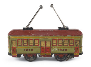 Vintage tin plate lithographed windup street trolley car marked "1933" with two pantographs; "MADE IN JAPAN" with unidentified trademark on each end. Length: 24cm (9.5").